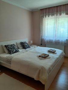 A bed or beds in a room at Villa Csilla elegant house