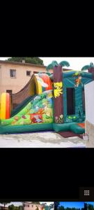 a water slide in a park with a playground at Mobile-home hyeres var climatisé dans camping avec piscine jusqu'à 6 personnes in Hyères