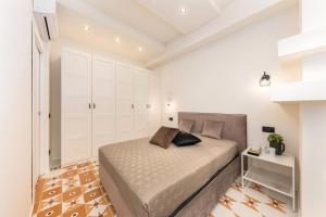 Een bed of bedden in een kamer bij Casa da Suite Icona