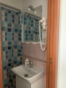 a bathroom with a sink and a shower at A Sorrento in Sorrento +39 photos