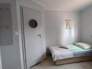 Postel nebo postele na pokoji v ubytování U Zajączka