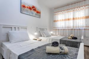 Postel nebo postele na pokoji v ubytování Hidden Gem - ZF Hvar