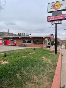 a fast food restaurant with a sign in front of it at Sunglow Motel in Bicknell