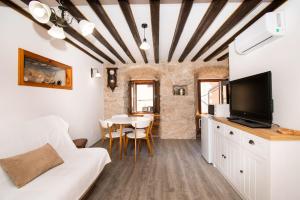 a living room with a couch and a table at Apartment Rustika in Skradin