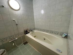 Koupelna v ubytování HOTEL マナティ + 7 fotografií