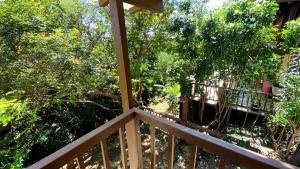 a view from the balcony of a house with trees at Condomínio Eco Resort Lençóis in Barreirinhas