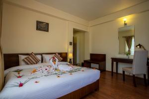 Rúm í herbergi á Siddhartha Boutique Hotel, Boudha