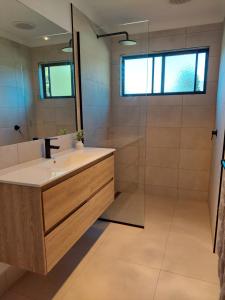 a bathroom with a sink and a shower at Cheeky Emu Spacious Family Accommodation Halls Gap in Halls Gap +37 photos