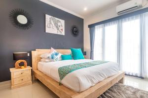 Ein Bett oder Betten in einem Zimmer der Unterkunft Villa Alhena