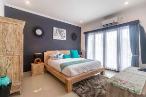 Ein Bett oder Betten in einem Zimmer der Unterkunft Villa Alhena