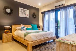 Ein Bett oder Betten in einem Zimmer der Unterkunft Villa Alhena