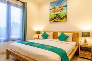 Ein Bett oder Betten in einem Zimmer der Unterkunft Villa Alhena