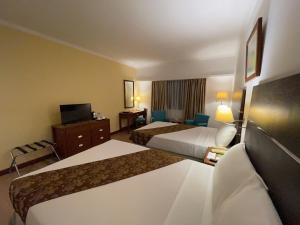 Postel nebo postele na pokoji v ubytování Days Hotel by Wyndham Iloilo