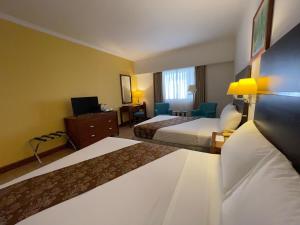 Postel nebo postele na pokoji v ubytování Days Hotel by Wyndham Iloilo