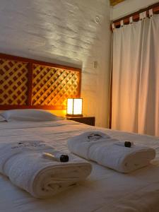 Cama o camas de una habitación en Delfines de Chicama Hotel