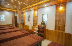 a room with four beds in a room at Phố Seoul Homestay And Spa in Hoi An