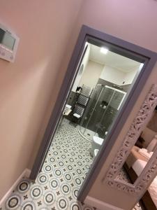 a bathroom with a mirror and a toilet at The world suite in Tropea +24 photos
