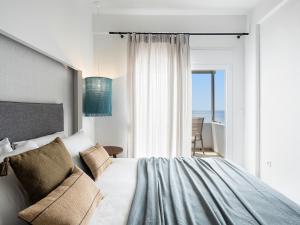 Posteľ alebo postele v izbe v ubytovaní Anthos