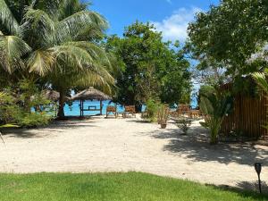 a resort with a beach with a table and chairs at KALUME' Eco Boutique Resort-Adult only in Koh Kradan