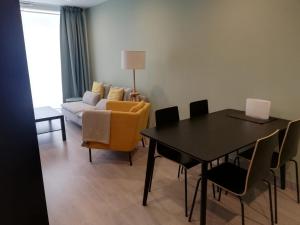 a living room with a table and a couch at Casa Baratura in Cangas del Narcea