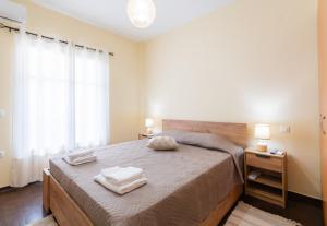 Postel nebo postele na pokoji v ubytování Cozy Platytera apartment