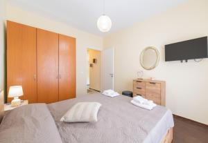 Postel nebo postele na pokoji v ubytování Cozy Platytera apartment