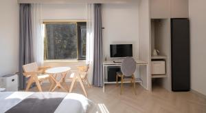 TV a/nebo společenská místnost v ubytování Denbasta forest Hotel