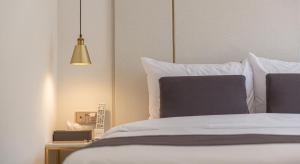 Postel nebo postele na pokoji v ubytování Denbasta forest Hotel