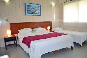 Postel nebo postele na pokoji v ubytování Hotel Nitana