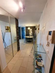 a room with a hallway with a table in a room at Lucia Exclusive with parking in the garage in Poreč