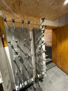 a rack of tools on a wall in a room at Chalet de l’Alpette in Valloire