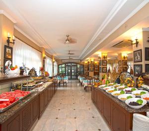 a buffet line with many plates of food on display at Hotel Sinatra in Kemer