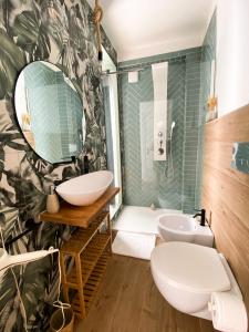 a bathroom with a sink and a mirror at Finestra sulla Sicilia in Catania