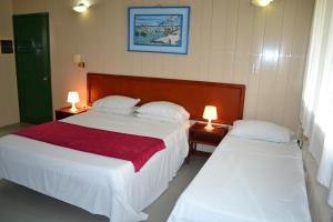 Postel nebo postele na pokoji v ubytování Hotel Nitana + 37 fotografií