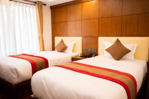 Hotel Kailash Kutee客房内的一张或多张床位