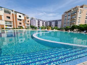 The swimming pool at or close to Studio Apartment with balcony 300m from beach