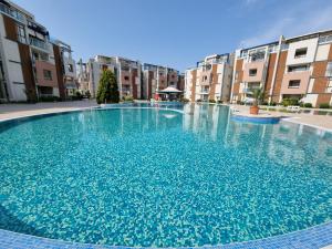 The swimming pool at or close to Studio Apartment with balcony 300m from beach