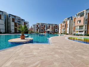 The swimming pool at or close to Studio Apartment with balcony 300m from beach