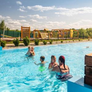 a group of people in a swimming pool at apartmán Sedmička Frymburk in Frymburk