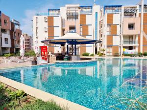The swimming pool at or close to Studio Apartment with balcony 300m from beach
