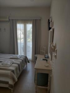 Postel nebo postele na pokoji v ubytování Alkyon Hotel