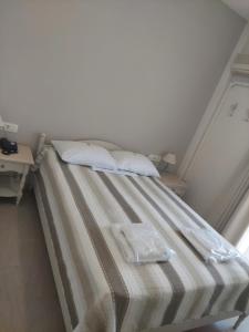Postel nebo postele na pokoji v ubytování Alkyon Hotel