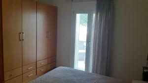 Posteľ alebo postele v izbe v ubytovaní ILIANA.APARTMENTS