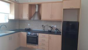 Kuchyňa alebo kuchynka v ubytovaní ILIANA.APARTMENTS