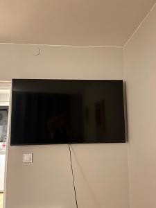 a flat screen tv hanging on a wall at Pod Jabłoniami - Roztocze Susiec Paary in Pary
