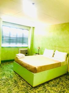 Postel nebo postele na pokoji v ubytování Benson Hotel San Juan CIty + 37 fotografií