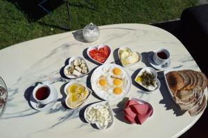 a table with a bunch of breakfast foods on it at BRABO in Landskrona