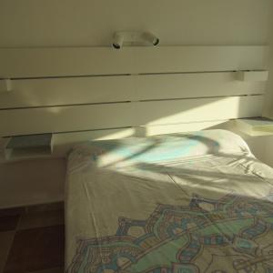 Postel nebo postele na pokoji v ubytování Edificio Montecarlo Playa San Juan