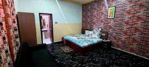 Ένα ή περισσότερα κρεβάτια σε δωμάτιο στο Kikis Court Resort