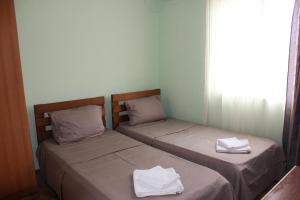 Postel nebo postele na pokoji v ubytování Hotel Premium